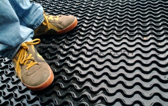 Trainers on a rubber mat