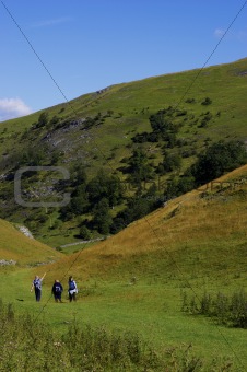 Group of people walking in hills