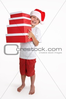 Child holding a stack of gift boxes