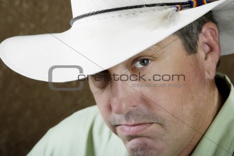 Man under a cowboy hat