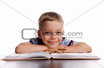 Smiling schoolboy with book
