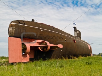 Submarine on green field