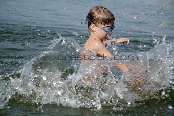 boy splashing in water
