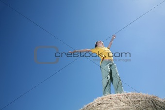 Boy on haystack