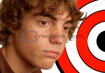 teen boy with target by head