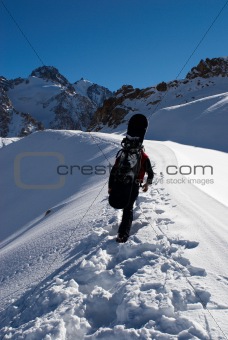 Snowboarder uphill for freeride