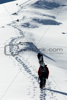 Snowboarder uphill for freeride
