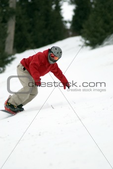 Snowboarder turn on ski slope
