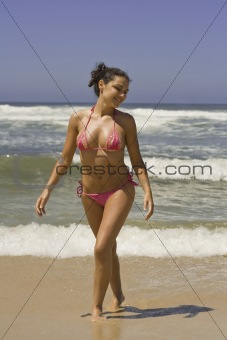 Woman walking in the beach