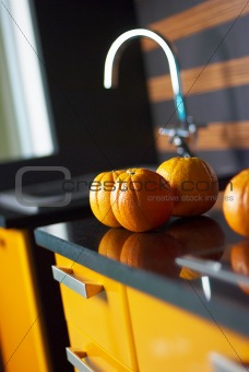 Orange in kitchen on table