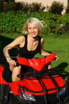Portrait of a beautiful young lady on the all-terrain vehicle (A