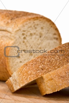 Sliced bread on wooden plate