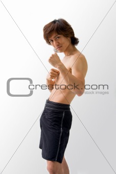 Asian guy in fighting pose