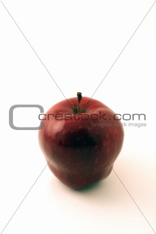 Lone apple on white
