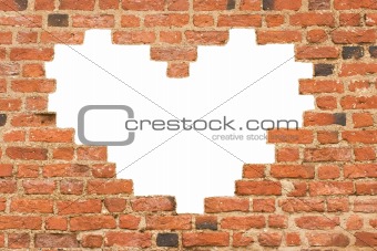 Heart shaped hole in  brick wall