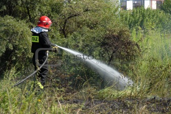 Fireman fighting a heath fire in Gdansk, Poland