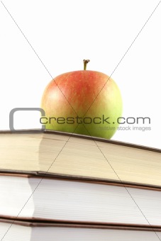 books pyramid with apple on top