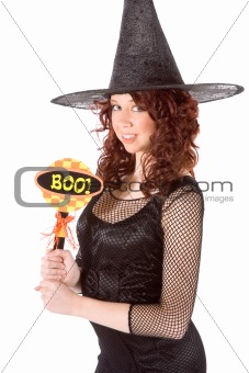 teen girl in Halloween hat with "boo!" sign