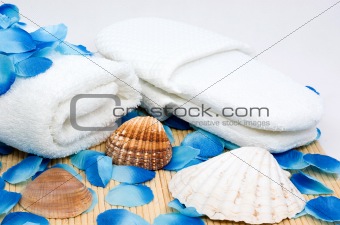 Towel and slippers for spa with sea shells