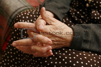 Hands of the elderly woman