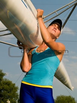 Girl holding boat