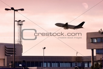 cargo jet taking off at dusk.
