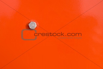 Orange panel and bolt head