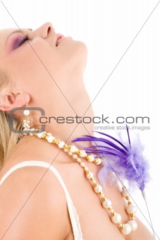 Young woman with violet feather