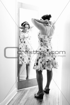 Woman in front of mirror