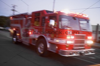 Fire engine driving down street