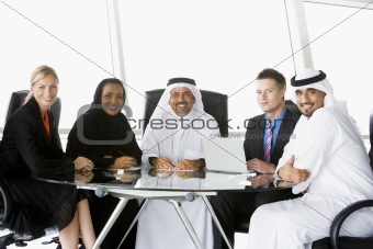 A  business meeting with Middle Eastern and caucasian men and wo
