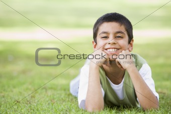 Boy relaxing in park