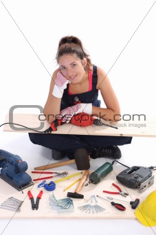 woman carpenter with work tools 