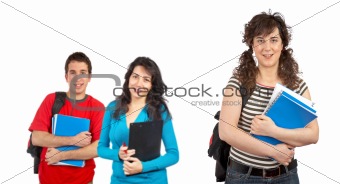 Three students with books and backpacks