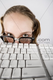 Young Nerdy Girl with a Keyboard