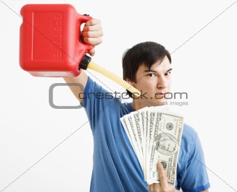 Man pouring gas on money.