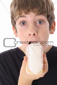 kid eating a donut isolated on white