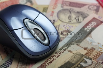 Mouse with indian and iranian currency in background