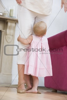 Mother in living room with baby