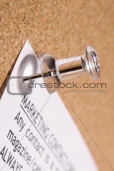 Close Up Of Thumbtack In Bulletin Board