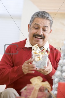 Man Excited To Open Christmas Present