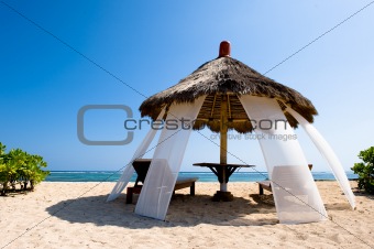 exotic hut on tropical beach