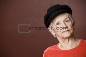Senior woman in a Greek fishing hat