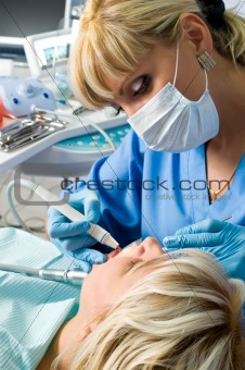 dentistry, doctor and patient, drilling the tooth