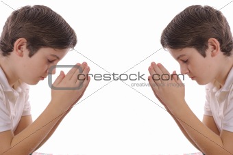 Twin brothers praying isolated on white