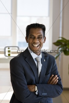Indian Business Man Laughing with Arms Folded