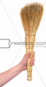 Old dirty broom in hand