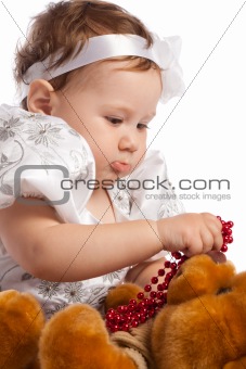 Girl playing with bear, isolated