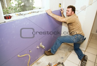 Worker Installing Drywall