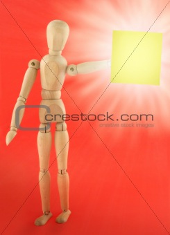 wooden figure with empty note